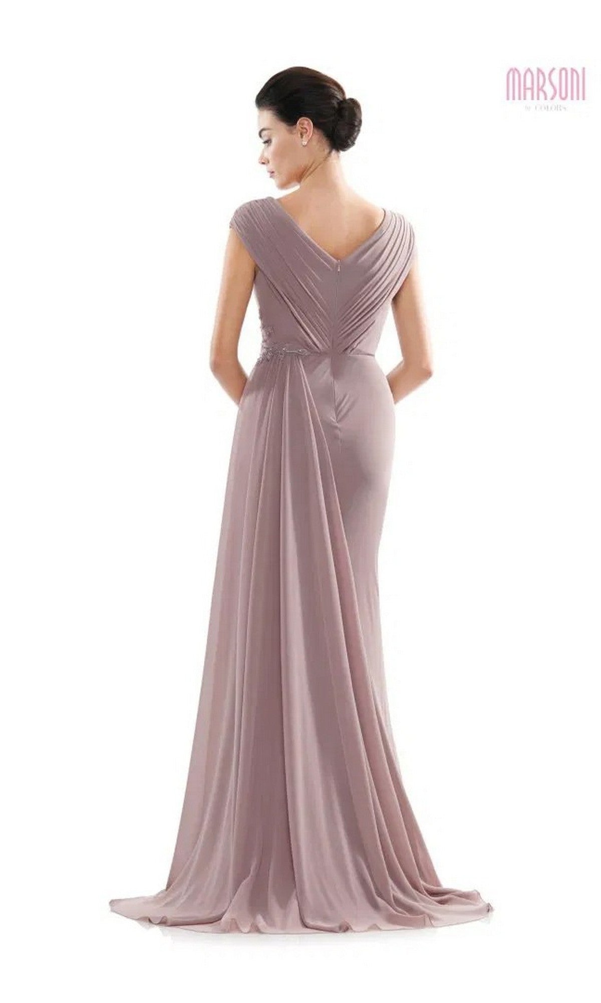 A woman stands facing away against a white background, wearing the Marsoni MV1080 Long Formal Dress—a mauve chiffon evening gown with draped fabric and a v-shaped back.